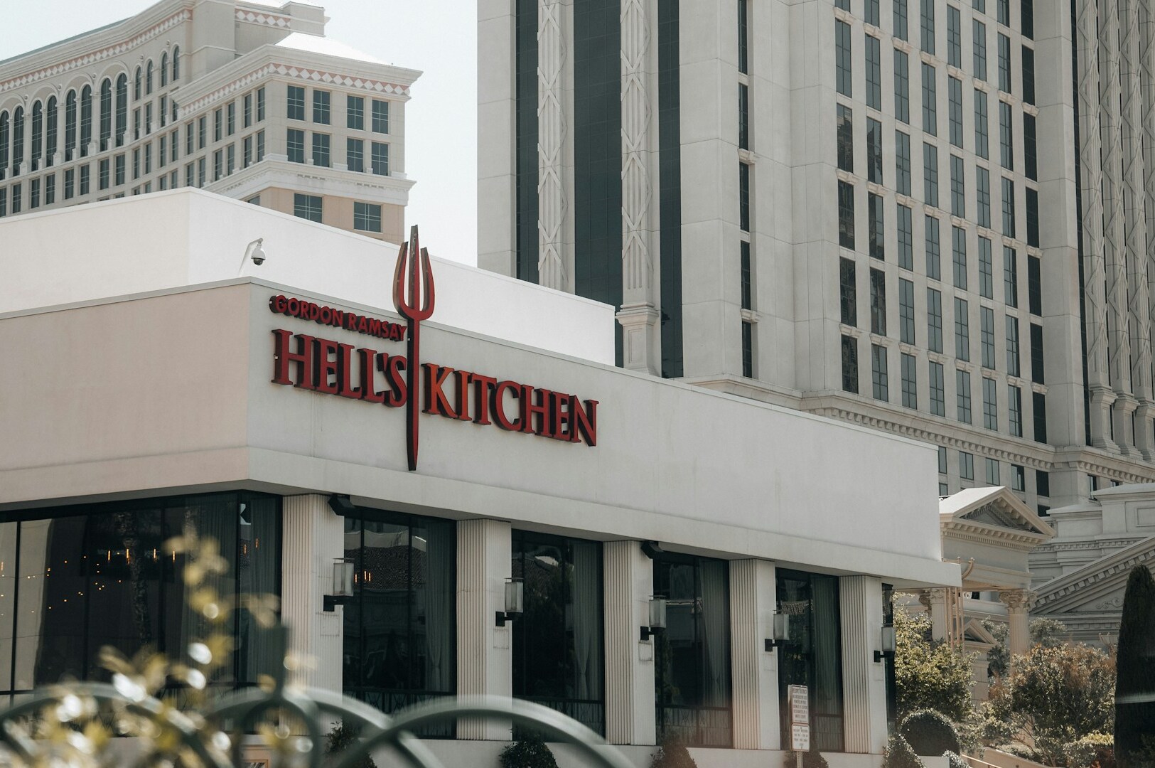 A building displaying the "Hell's Kitchen" sign, associated with renowned Michelin-starred chefs like Gordon Ramsay.