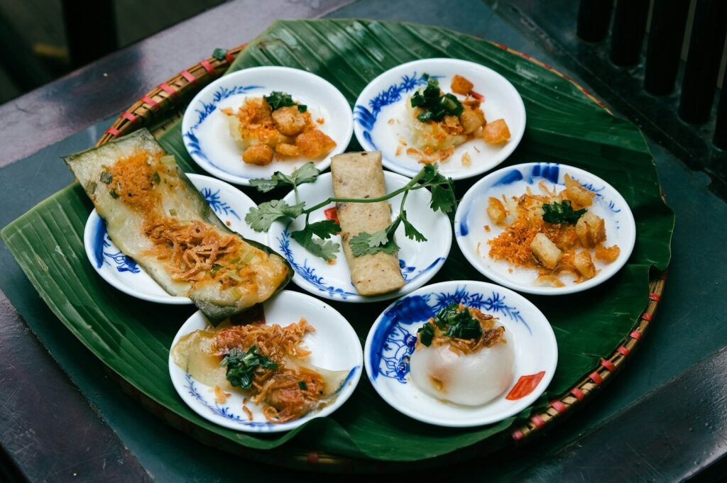 A vibrant plate of Peranakan cuisine served on a banana leaf, showcasing Singapore's culinary trend for 2025.