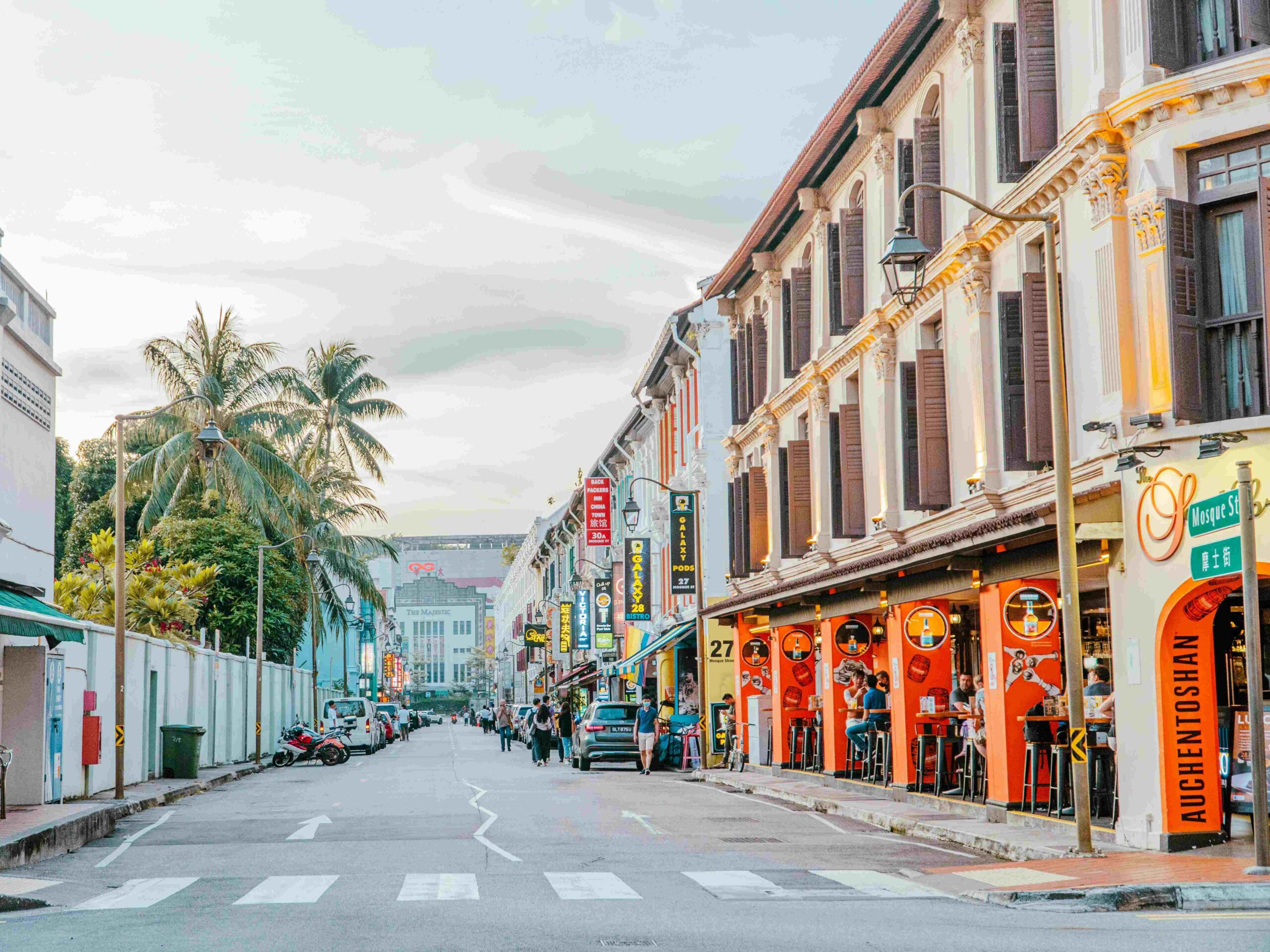 Colorful Singapore shophouses and restaurants along a lively street, representing the vision to make Singapore a world-class destination for food and dining culture.