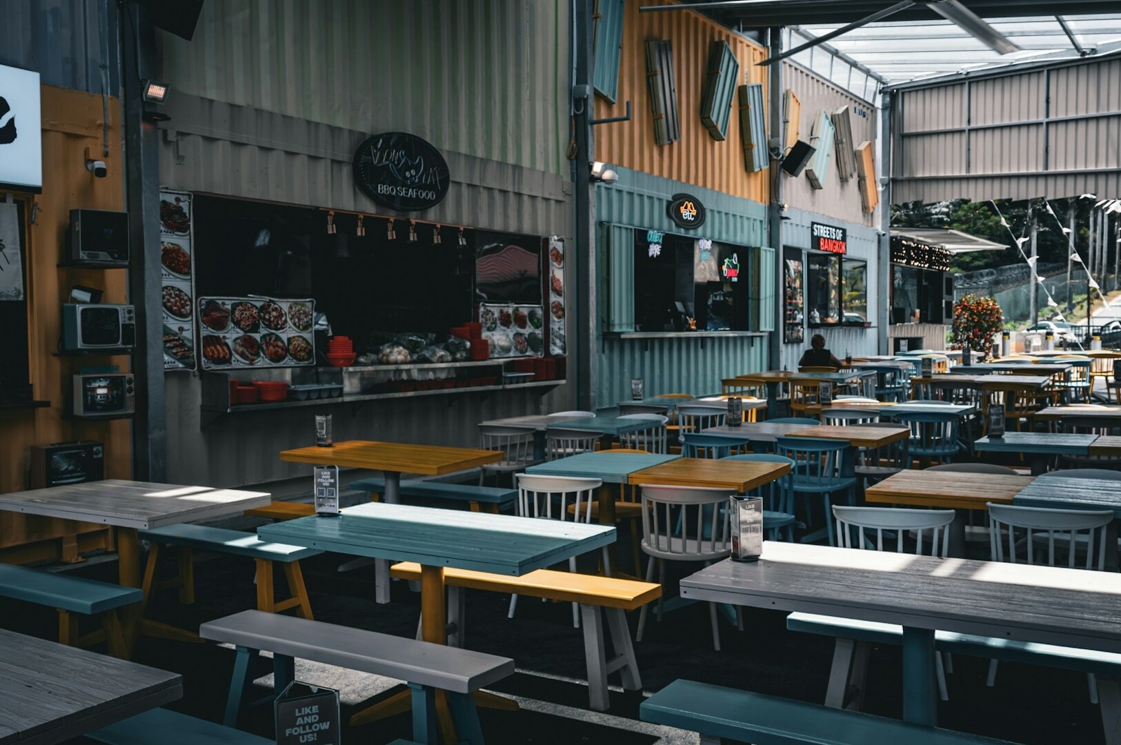 A spacious restaurant, featuring tables and chairs arranged for dining experiences.
