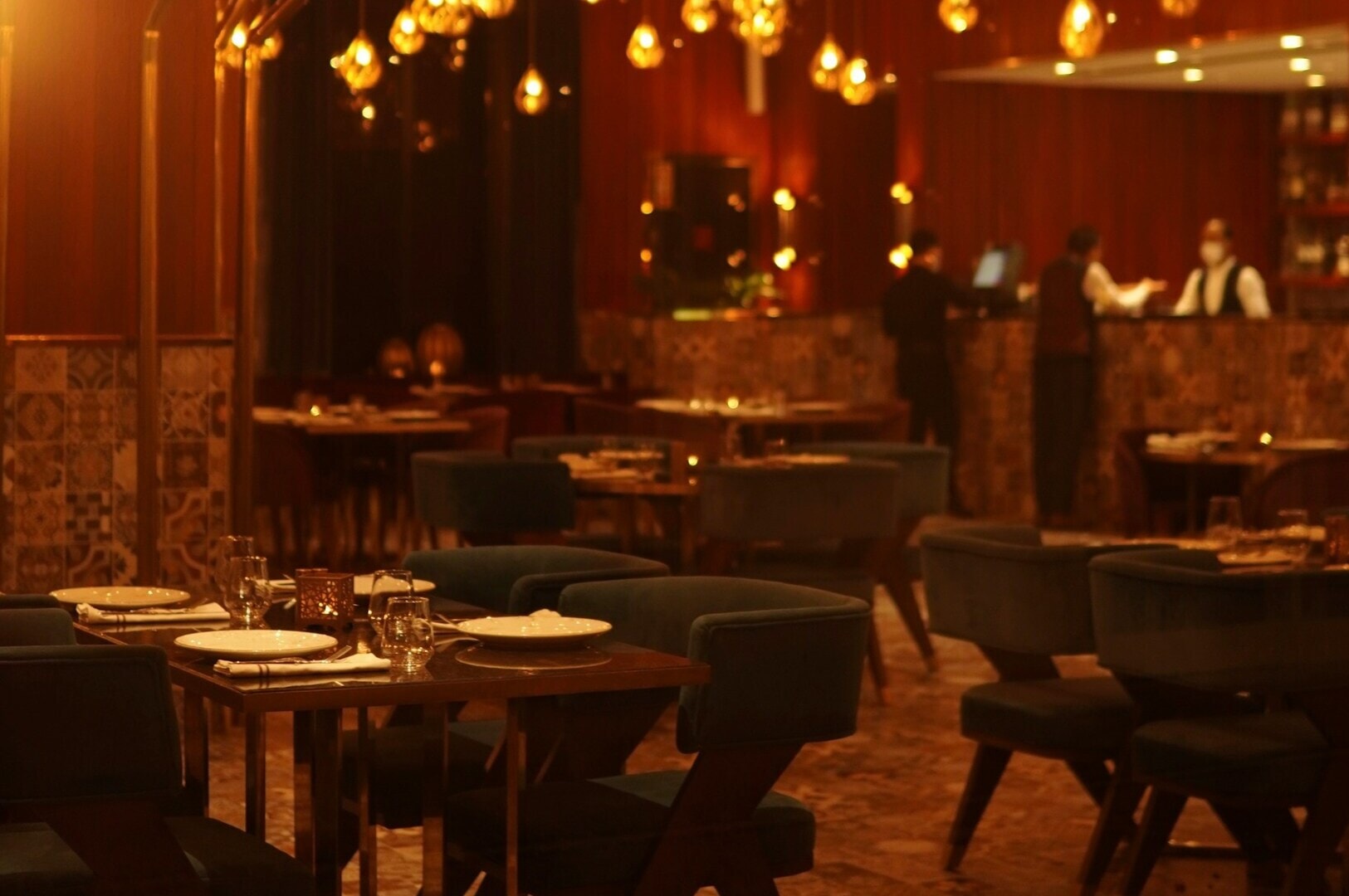 A Singapore restaurant featuring tables and chairs arranged in the center for dining.