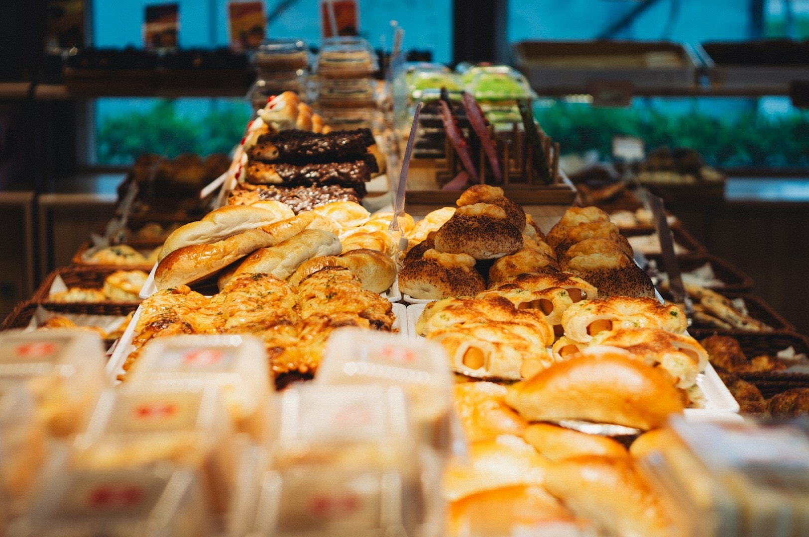 A vibrant bakery display showcasing various breads and pastries, highlighting offerings at Bread Street Kitchen for private dining.