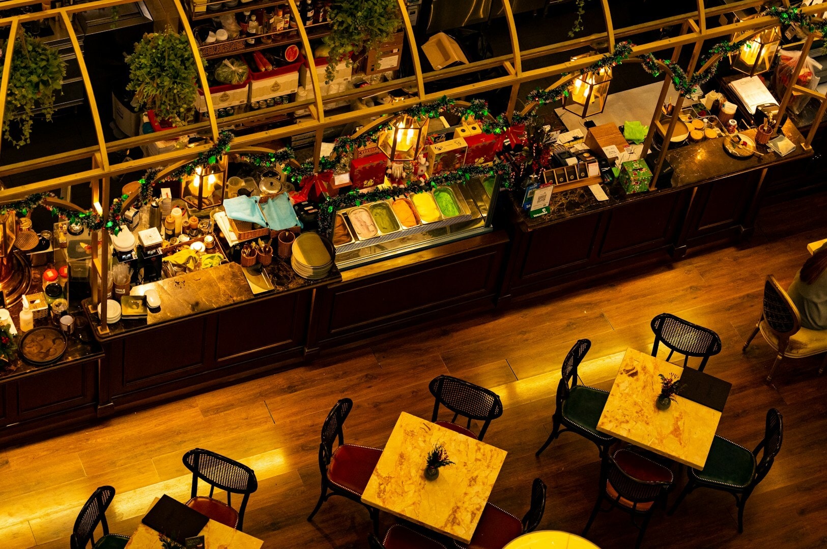 Interior view of a restaurant with neatly arranged tables and chairs for The Celebrity Chef Culinary Experience in Singapore.