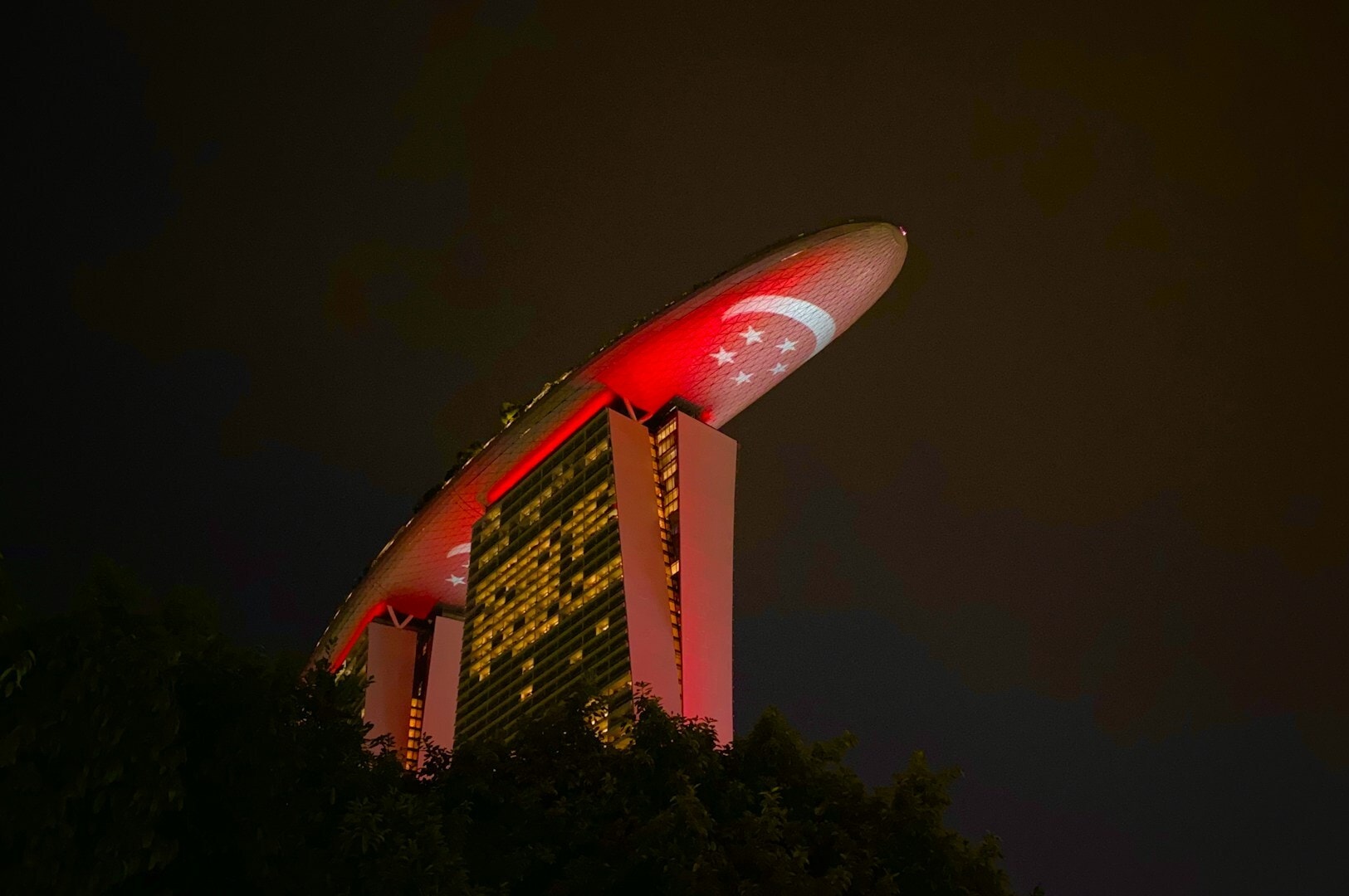 The Marina Bay featuring a prominent red light, highlighted in the Marina Bay Restaurants dining guide for 2025.