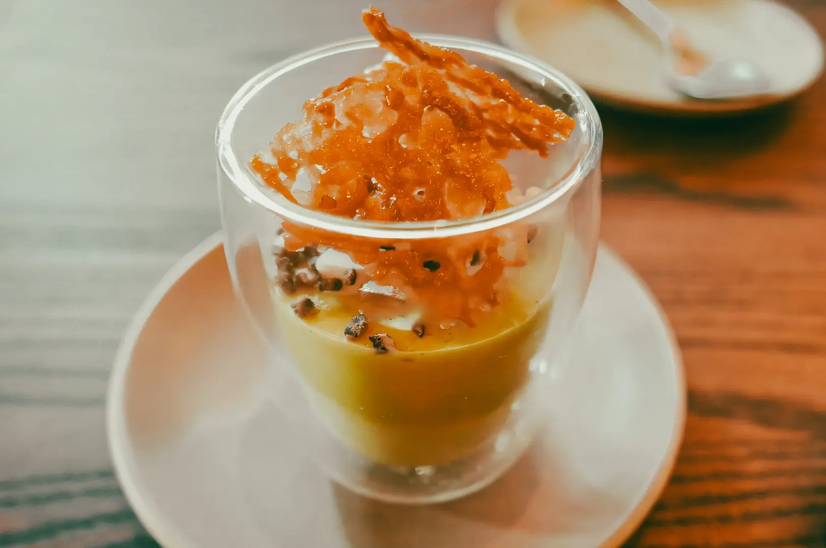 Pandan coconut mousse dessert with caramelized topping, showcasing innovative Singapore dessert trends for 2026.