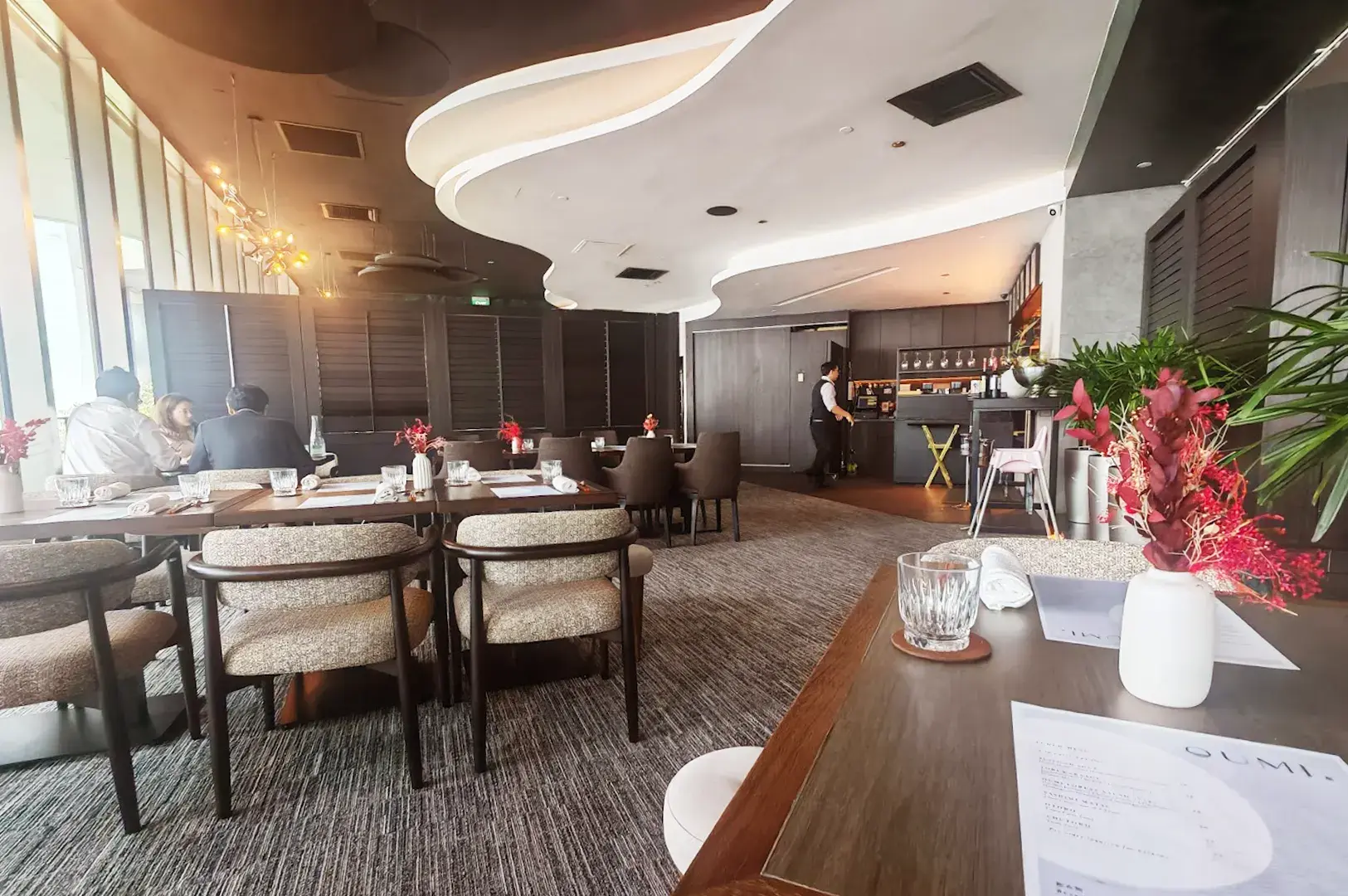 Elegant interior of OUMI, showcasing modern Japanese design and a sophisticated atmosphere perfect for Japanese food lovers in Tanjong Pagar.
