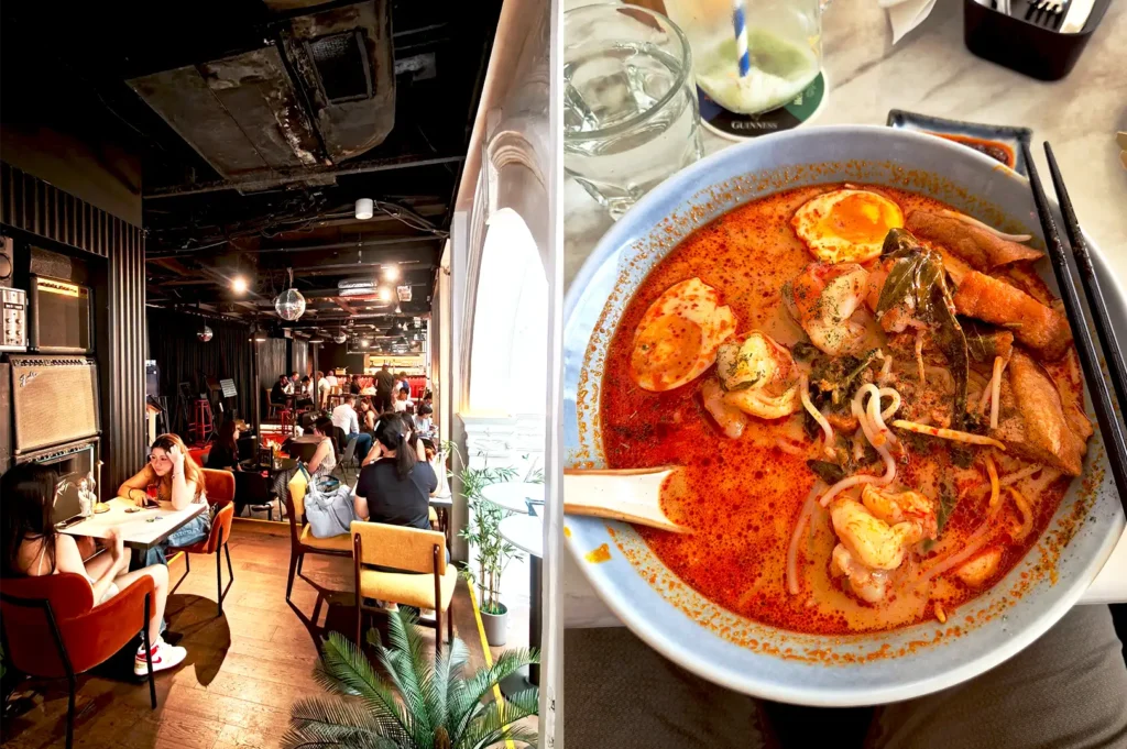 The lively and cozy interior of Acid Bar & Restaurant near Somerset, featuring a bowl of rich Baba's Laksa, making it a popular destination for late-night meals with friends.