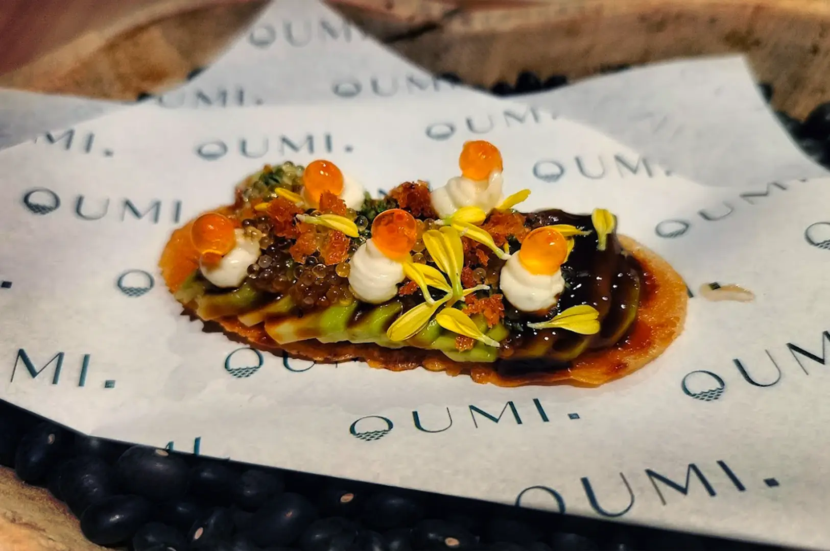 A beautifully plated Japanese dish at OUMI, featuring the Foie Gras Monaka, exemplifying the exquisite cuisine available in Tanjong Pagar.