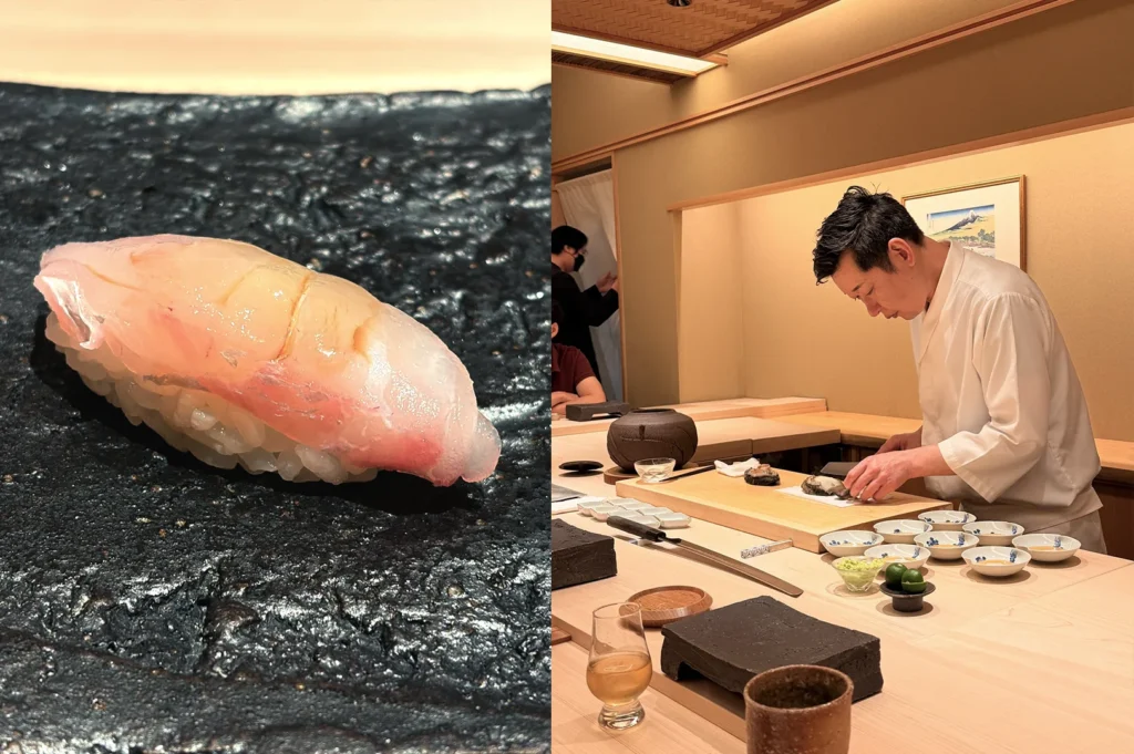 A single piece of seasonal nigiri served at Sushi Sakuta, showcasing the minimalist presentation typical of their refined omakase experience.