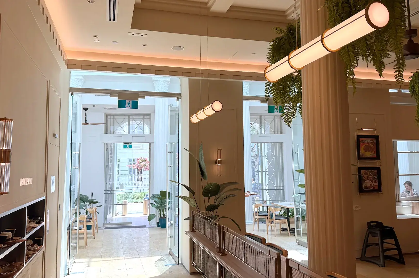 Elegant and airy interior of Rempapa restaurant in Singapore, showcasing a blend of heritage design and modern comfort.