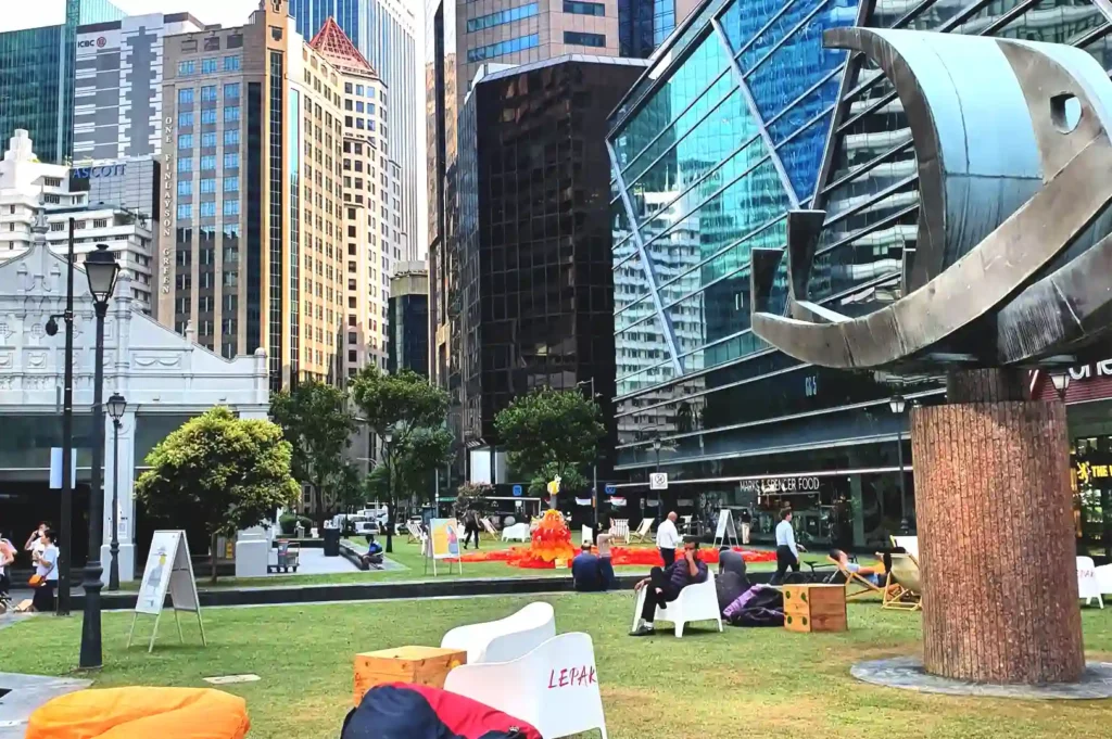 Exterior view of the iconic Republic Plaza building and surrounding park area in Singapore’s Central Business District.