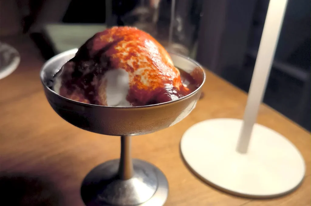 A metallic dessert goblet containing the special Burrata gelato served at Fico Singapore.