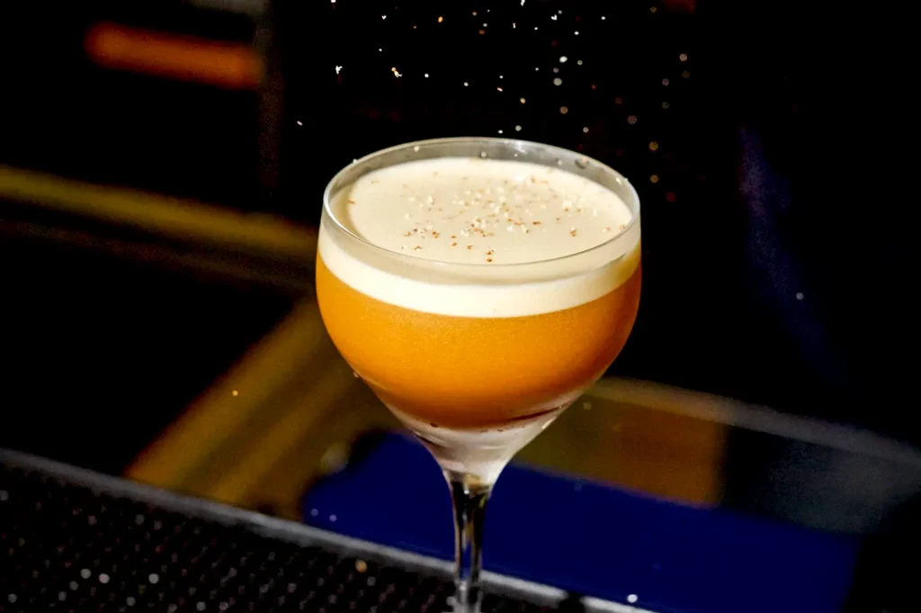 The signature Bak Kwa Old Fashioned topped with a smooth layer of foam and delicate spice sprinkles at Rasa Space.