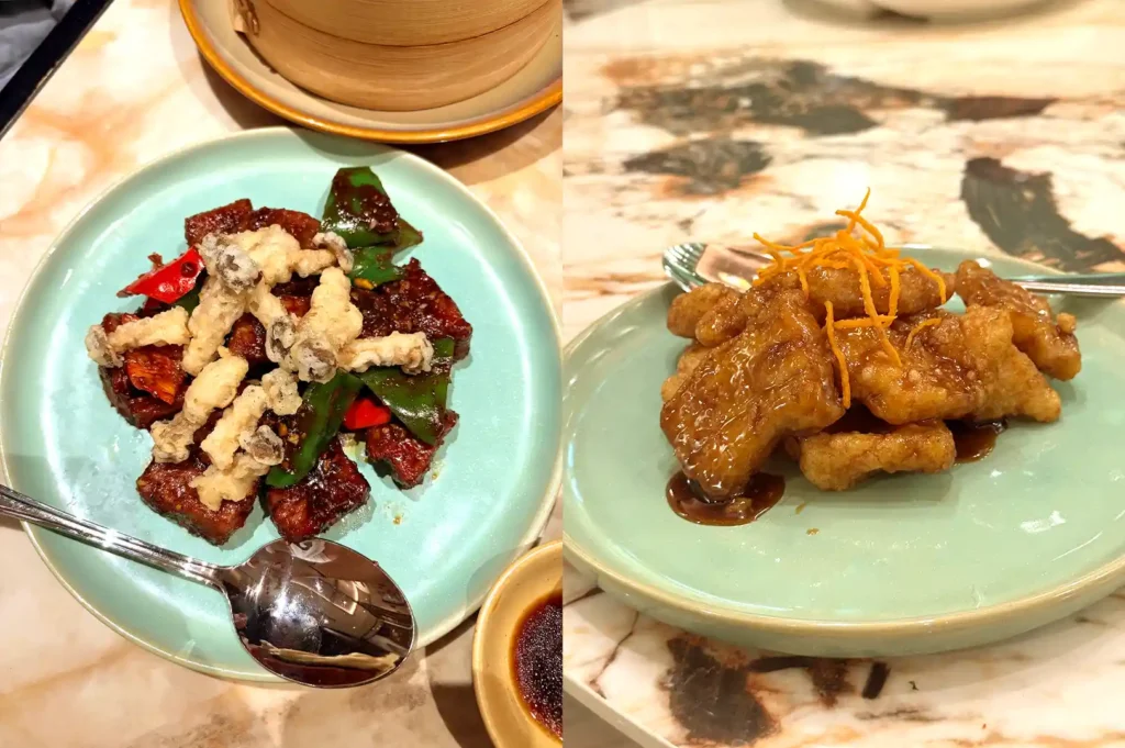 Crispy fried dishes served on light blue plates, including Szechuan Spicy chicken and a flavorful wild silver cod in black vinegar.