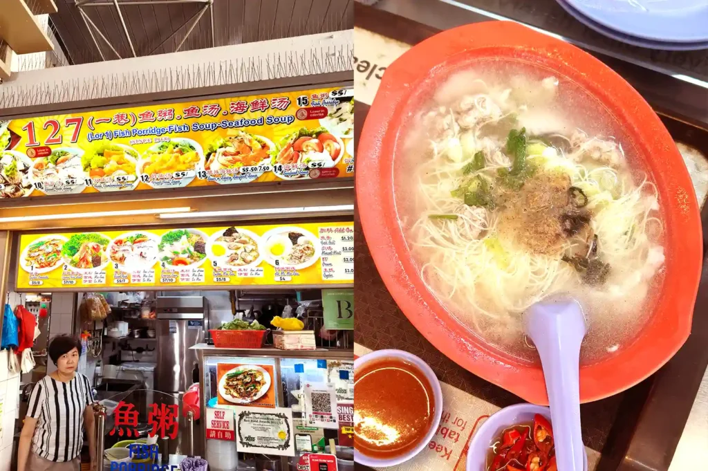 The colorful menu signage of 127 Lor 1 Toa Payoh Fish Soup alongside a bright red bowl of hot seafood and fish noodle soup.